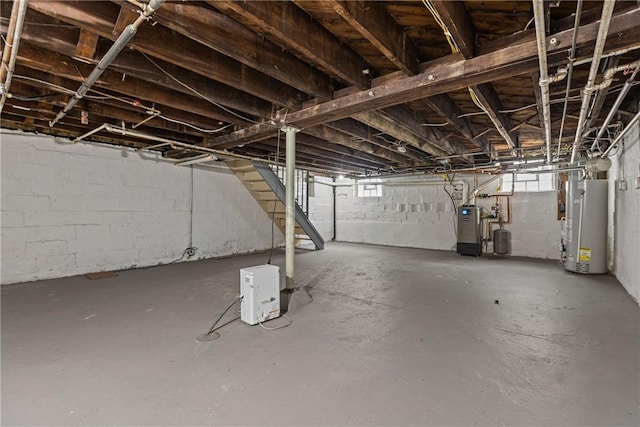 basement featuring plenty of natural light and gas water heater