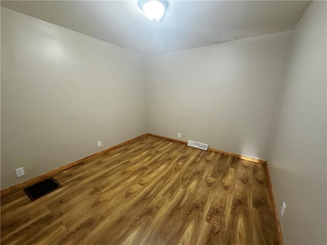 empty room featuring hardwood / wood-style floors