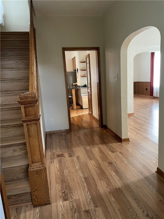 hall with light hardwood / wood-style floors