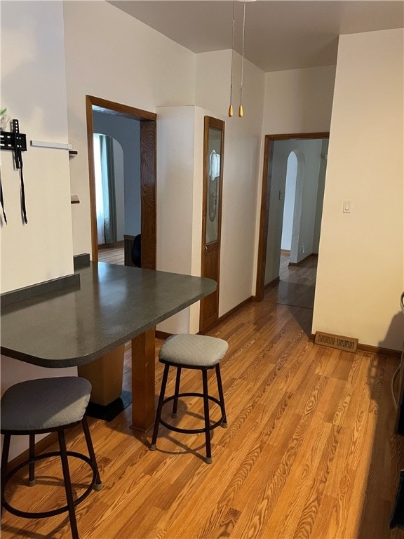 dining space with light hardwood / wood-style flooring