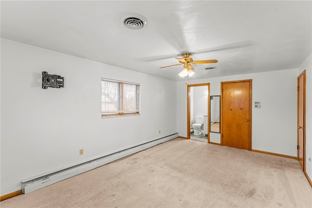 unfurnished bedroom with ceiling fan, connected bathroom, light colored carpet, and baseboard heating