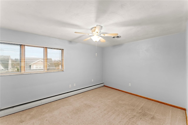 carpeted spare room featuring a baseboard radiator and ceiling fan