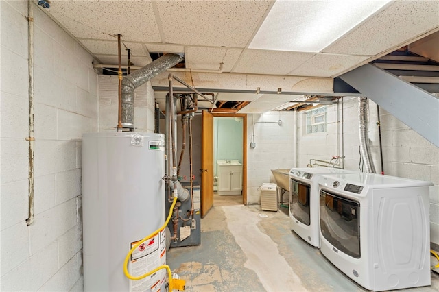 basement with washer and dryer and water heater