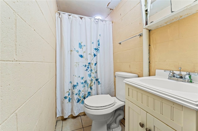 bathroom featuring vanity, toilet, curtained shower, and tile patterned flooring