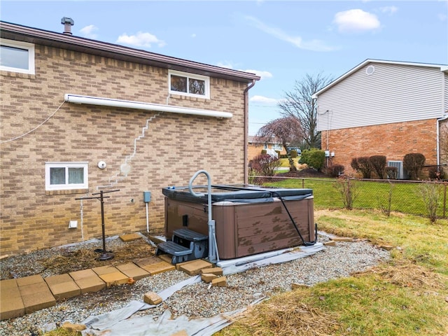 view of property exterior featuring a hot tub