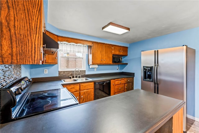 kitchen featuring sink, backsplash, and black appliances