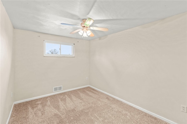 carpeted empty room with ceiling fan