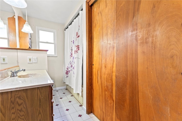 bathroom featuring vanity and a shower with shower curtain