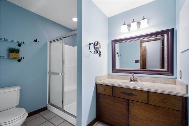 bathroom with an enclosed shower, vanity, tile patterned flooring, and toilet