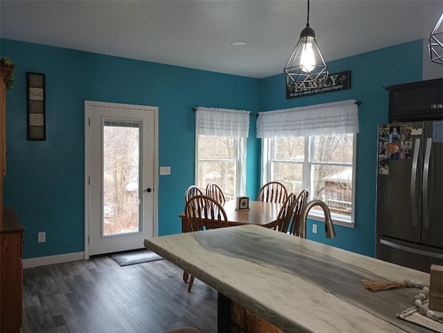 dining area featuring dark hardwood / wood-style flooring