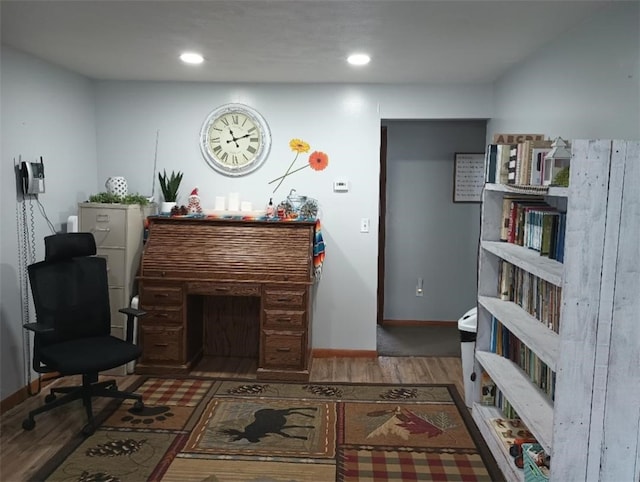 sitting room with hardwood / wood-style flooring