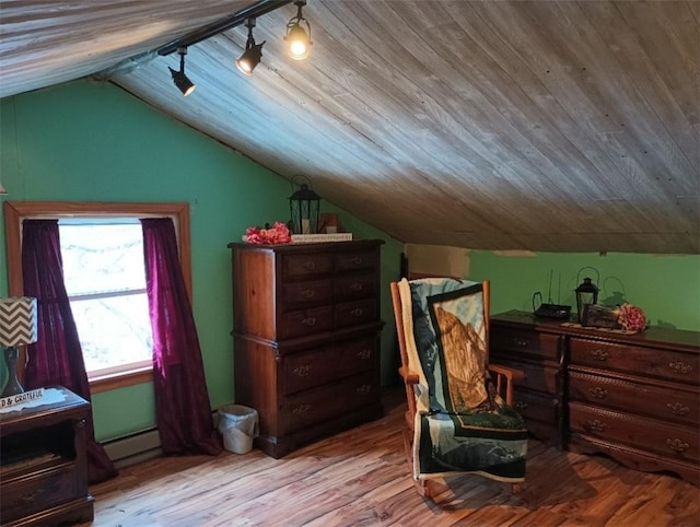 sitting room featuring lofted ceiling, wood ceiling, rail lighting, a baseboard heating unit, and light hardwood / wood-style floors