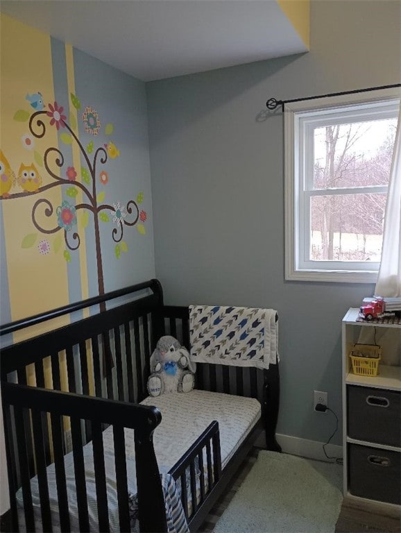 bedroom featuring a crib