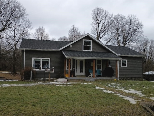 back of house with a yard and covered porch