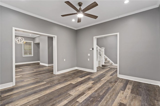 empty room with ceiling fan, ornamental molding, and dark hardwood / wood-style flooring