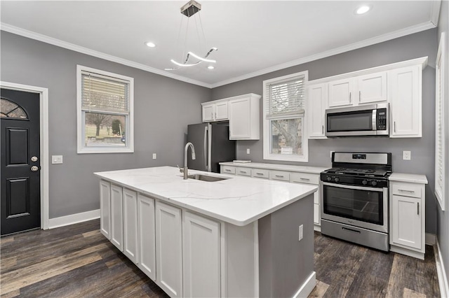 kitchen with sink, decorative light fixtures, stainless steel appliances, and white cabinets