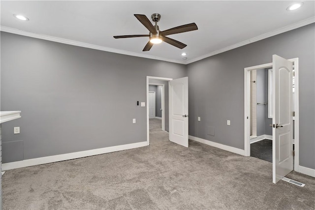 unfurnished bedroom featuring crown molding, carpet floors, and ceiling fan