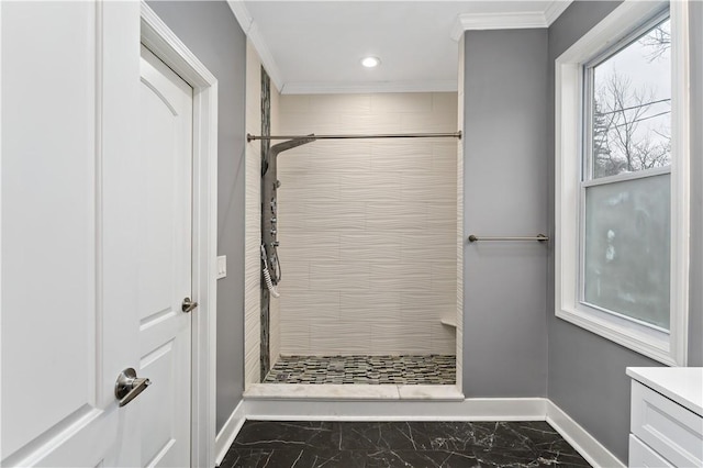 bathroom with crown molding and tiled shower