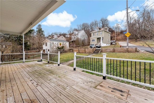 wooden deck with a yard