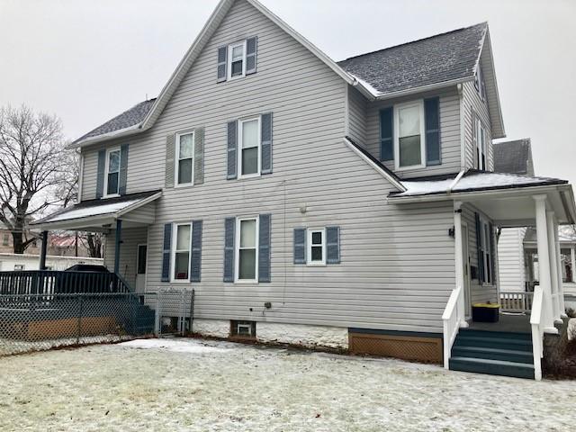 back of house with covered porch