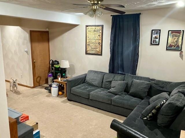 living room featuring light colored carpet and ceiling fan