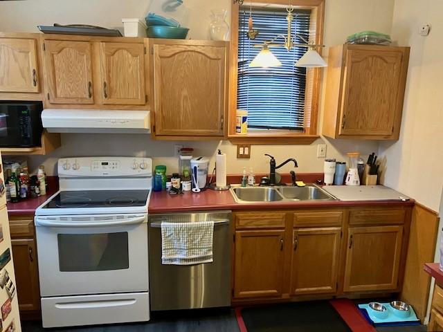 kitchen featuring sink, stainless steel dishwasher, and white electric range oven