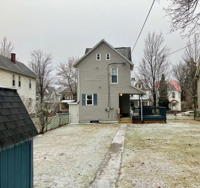 rear view of house with a porch