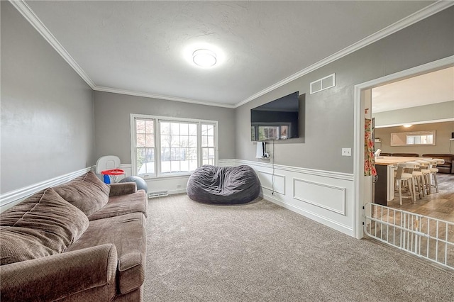 carpeted living room with ornamental molding