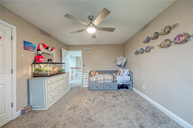 unfurnished bedroom featuring light colored carpet and ceiling fan