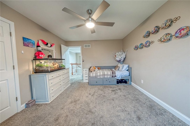 unfurnished bedroom featuring light carpet and ceiling fan