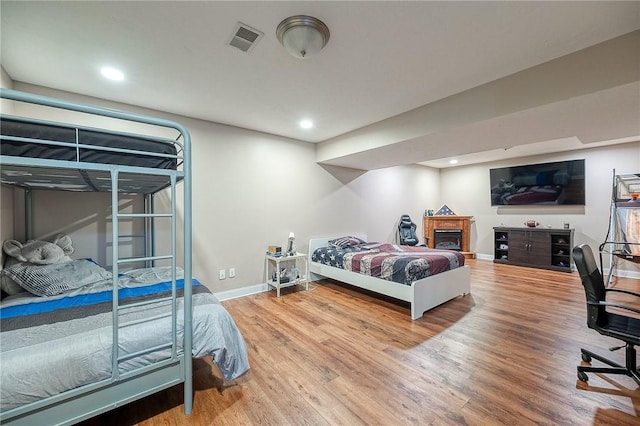 bedroom with wood-type flooring