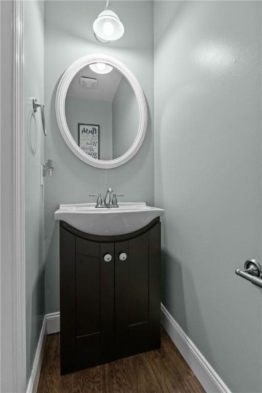 bathroom featuring hardwood / wood-style flooring and vanity