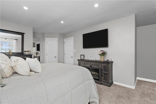 bedroom featuring light colored carpet