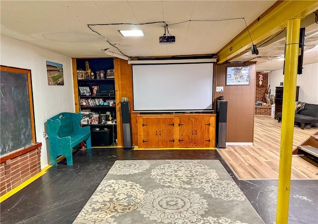 home theater room featuring dark hardwood / wood-style flooring