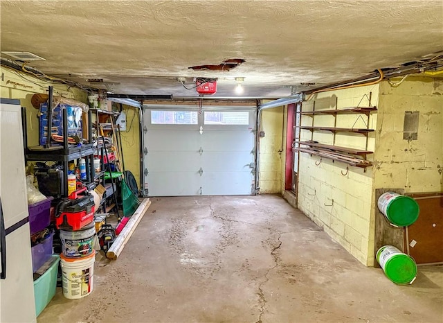 garage featuring a garage door opener