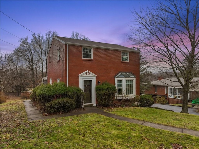 view of front of property with a yard