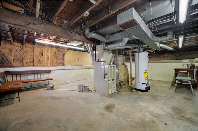 basement featuring heating unit and water heater