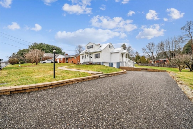 view of side of property featuring a yard