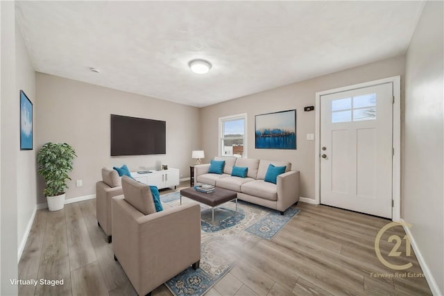 living room with light hardwood / wood-style flooring