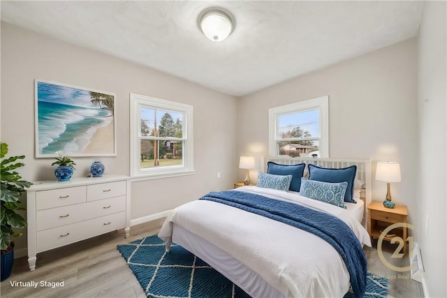 bedroom featuring light wood-type flooring