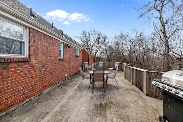 wooden deck featuring area for grilling