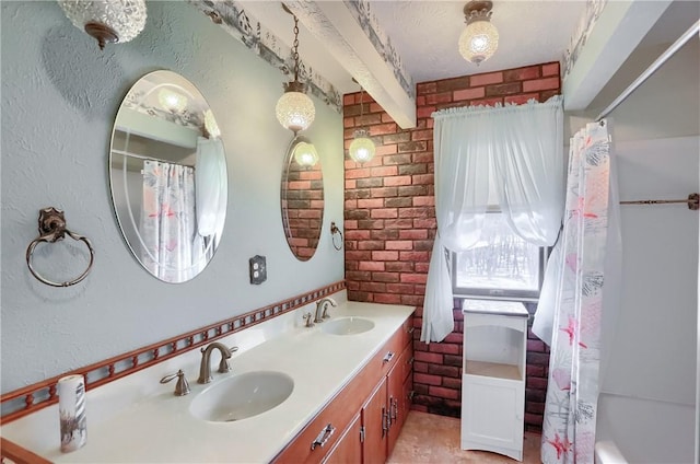 bathroom featuring vanity, shower / bath combo, and a textured ceiling