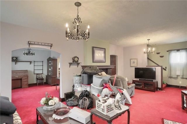 living room featuring a chandelier and carpet flooring