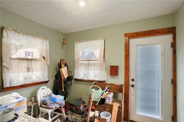 miscellaneous room featuring a textured ceiling