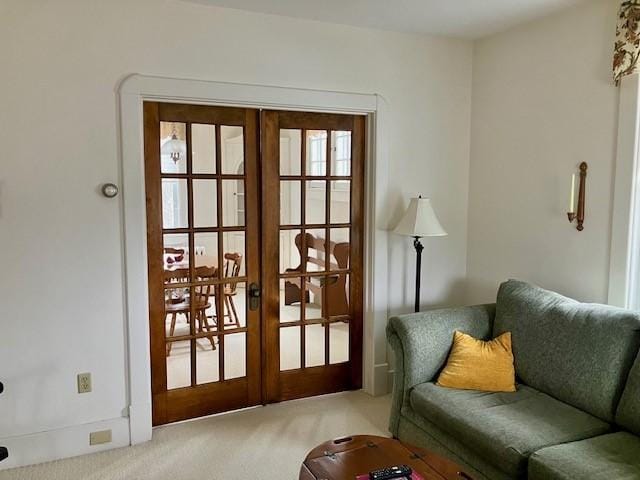 doorway featuring french doors and carpet