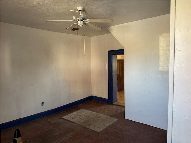 spare room with ceiling fan