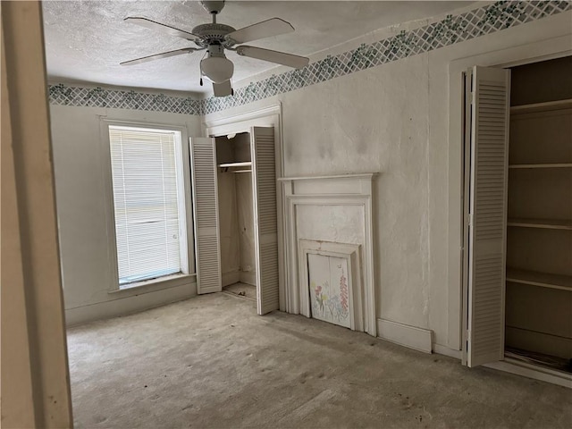 unfurnished bedroom with light colored carpet and ceiling fan