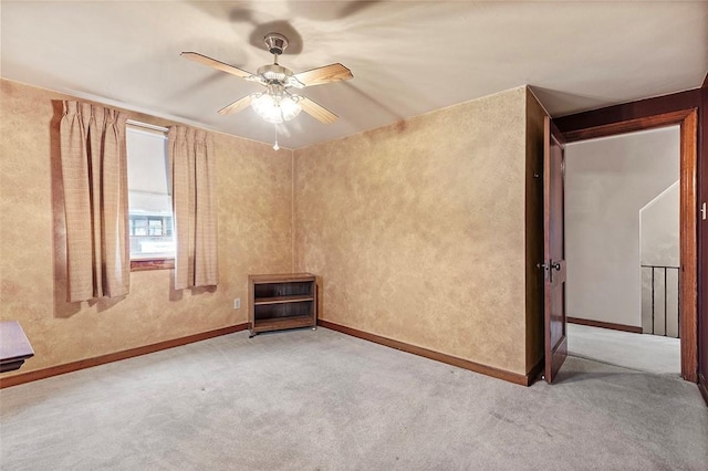 carpeted empty room with ceiling fan