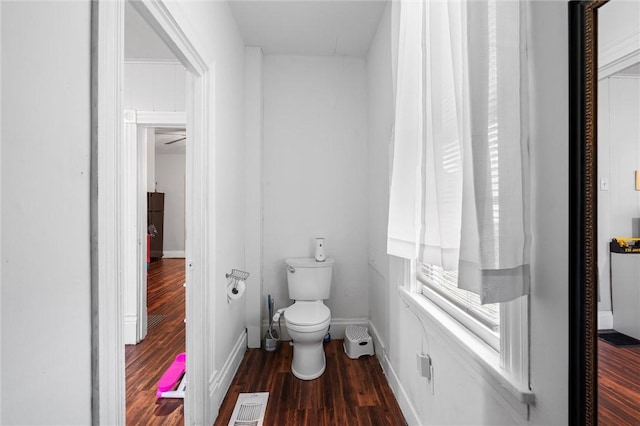 bathroom with wood-type flooring and toilet