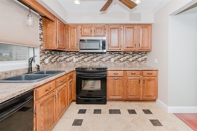 kitchen featuring tasteful backsplash, sink, ceiling fan, and black appliances